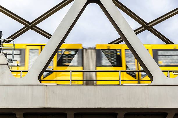 istock yellow moving tram on a bridge in berlin 178468504