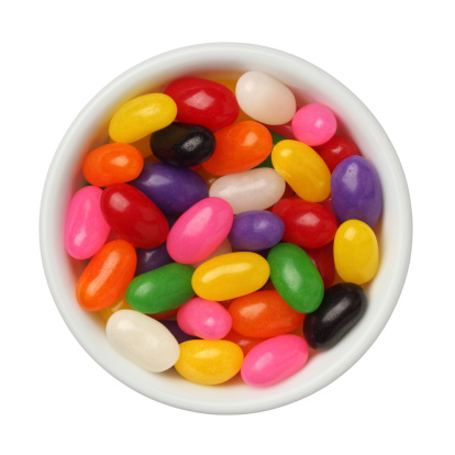 Jellybeans in a bowl isolated on white background, close up
