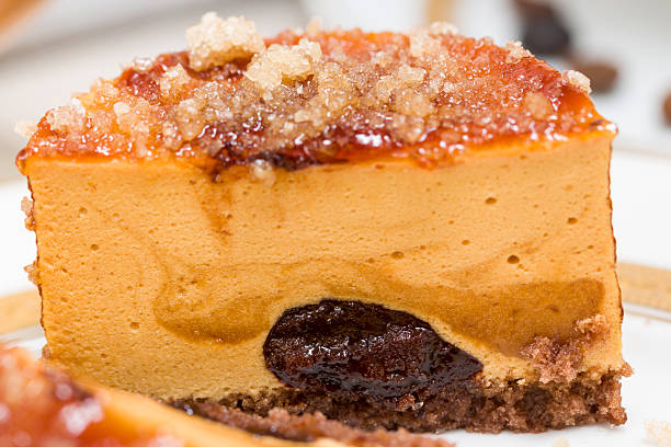 Caramel cake with chocolate cream and caramelized sugar over, macro stock photo