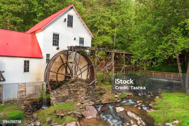 American Historic Trading Post And Water Mill Stock Photo - Download Image Now - Cottage, Springtime, Stream - Body of Water