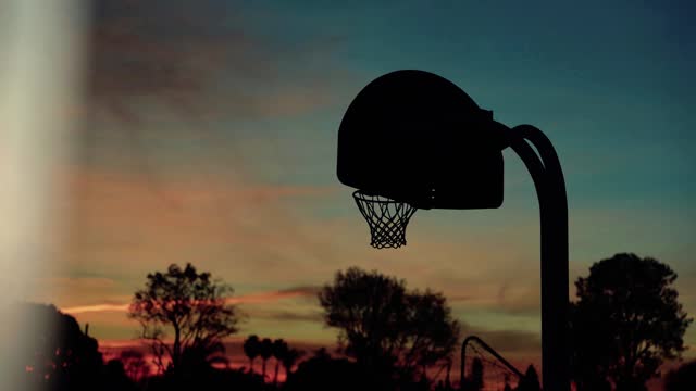 Empty basketball court at night. Nobody. Street sport. Basketball backboard and ring. stock video