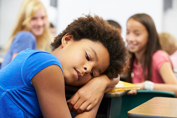 istock Unhappy Girl Being Bullied In Class 178470242