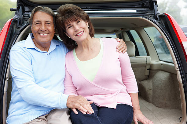 istock Senior Hispanic couple outdoors with car 178470442