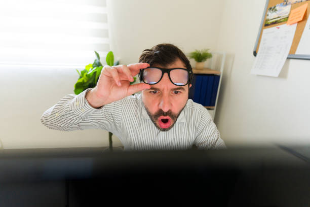 istock Surprised entrepreneur receiving good happy news at work 1784706266