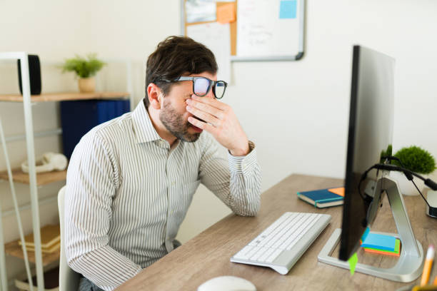 istock Sleepy tired boss looking exhausted working late at the office 1784706776