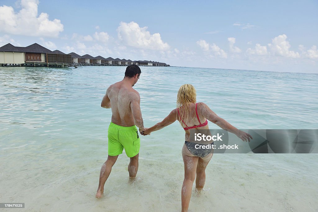 happy young  couple at summer vacation have fun and relax happy young  couple at summer vacation have fun and relax at beautiful sunny  day Adult Stock Photo