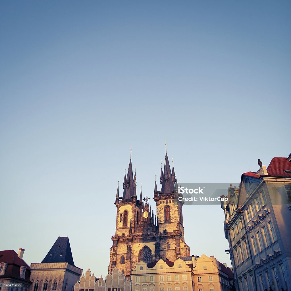 View of the  Tyn Church View of the Church of Our Lady before TÃ½n (Tyn Church) and the houses of the Old Town Square in Prague at dusk Architecture Stock Photo