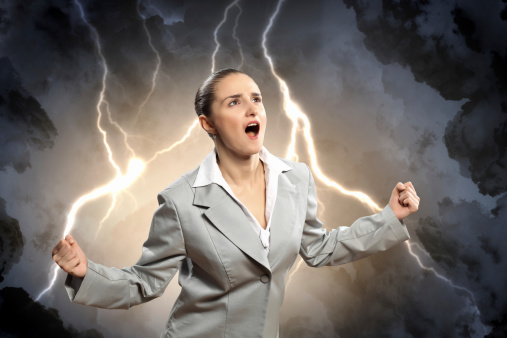 businesswoman in anger screaming against lightning background