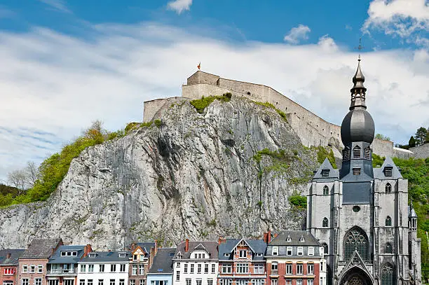 Church in the Belgian City of Dinant against Medieval Fortress