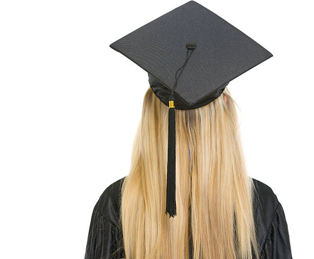istock Woman in graduation gown. rear view 178473670
