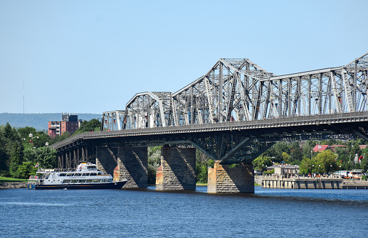 August 31, 2018 - Ottawa, Ontario, Canada: View of Capital Cruises boat below Alexandra Bridge on Ottawa river