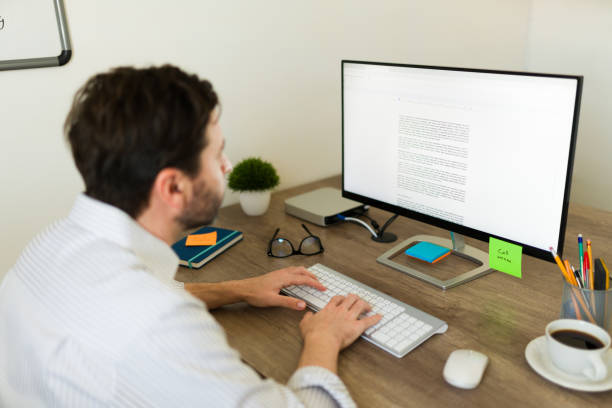 istock Busy latin man working and typing at his desk 1784744092