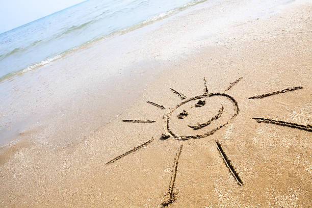 Smiley Sun On The Beach stock photo