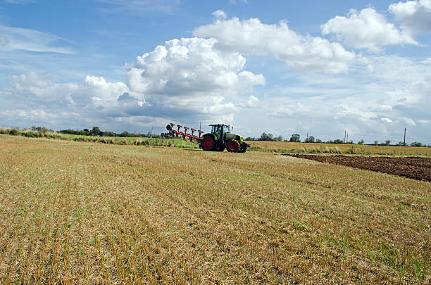 istock tractor prepare plow agricultural harvest field 178475550