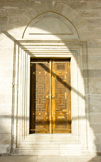 istock islamic figures in mosque door 178476689