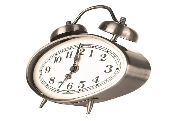 Hours an alarm clock on a white background
