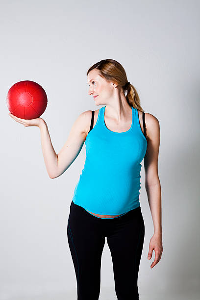 istock Pregnant woman exercising with exercise ball 178477758