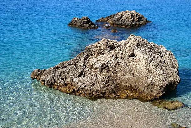 Photo of Rocks in the blue sea