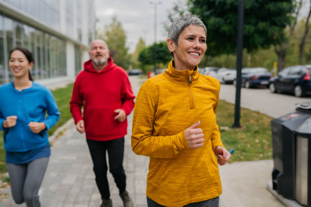istock Mature and senior people jogging at the park 1784781661