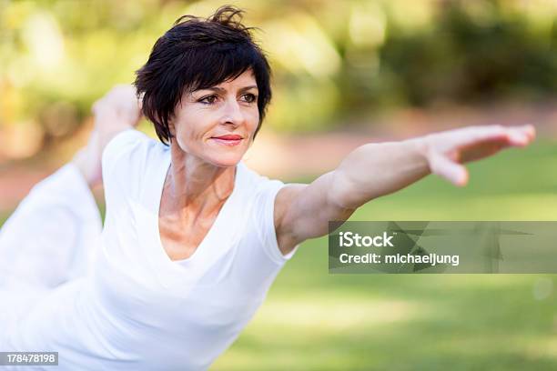 Healthy Middle Aged Woman Stretching Stock Photo - Download Image Now - Yoga, Women, Mature Women