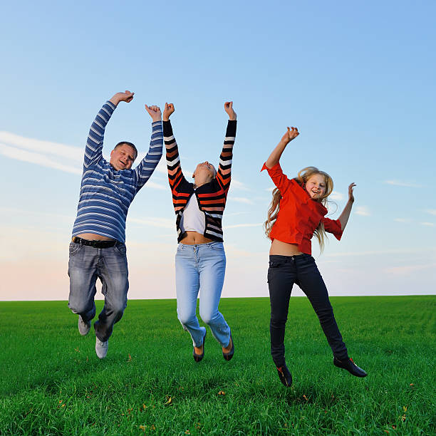 istock Happy young family jump for joy 178478217