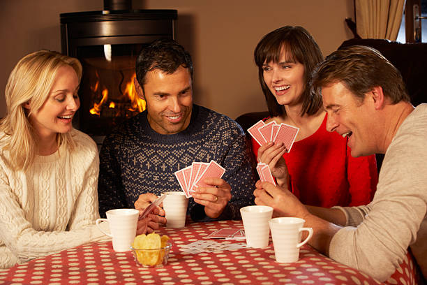 istock Group Of Middle Aged Couples Playing Cards Together 178478584