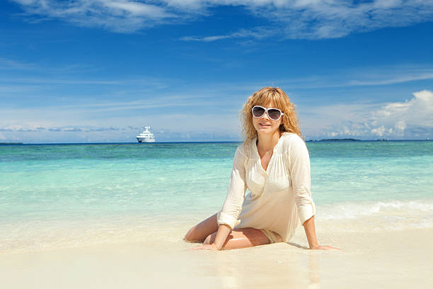 istock Happy young woman rest on the beach 178479402