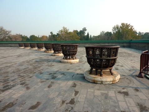 Temple of Heaven in Beijing. Ancient firepans around the Hall of Prayer for Good Harvests, a circular building that is the main spot of the all complex.