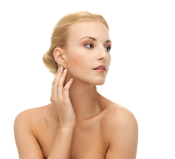 istock woman touching her face skin 178480032