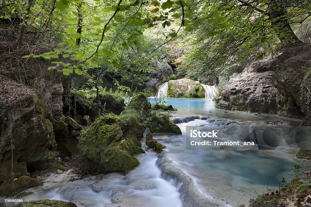 Deep forest (Northern Spain) Mountain river with beautiful turquoise color water. Autumn Stock Photo