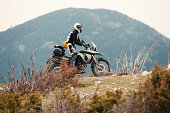 Adventure motorbike rider in nature