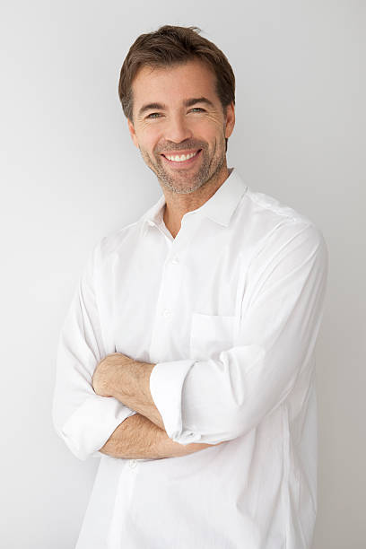 istock Smiling man in white shirt with crossed arms 178480487