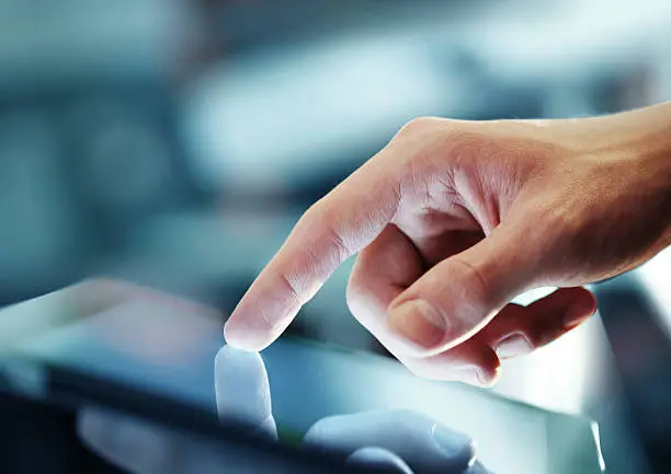 "businessman holding digital tablet, closeup"