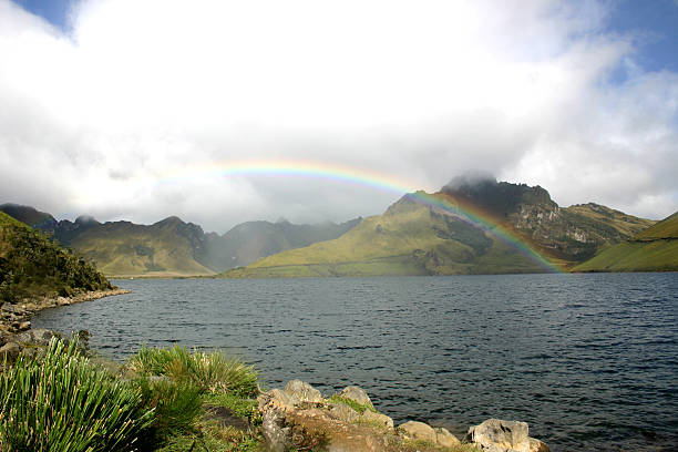 Rainbow Over Ecuador Lake stock photo