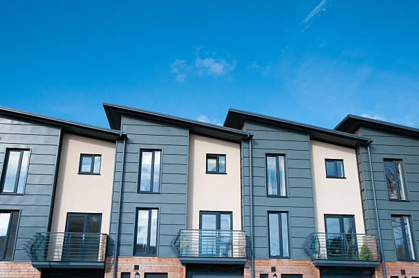 row of modern terraced townhouses - brownstone stok fotoğraflar ve resimler