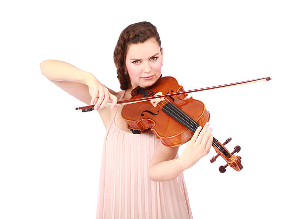 young girl violinist playing stock photo