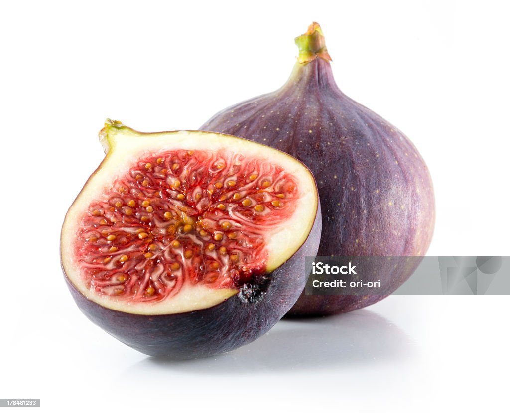 A halved and whole fig isolated on a white background Fresh figs isolated on white Fig Stock Photo