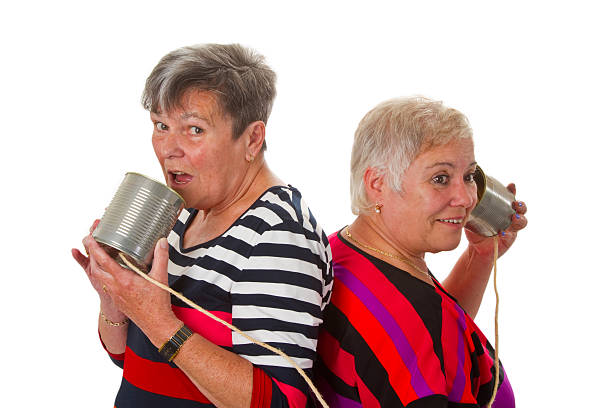 istock Female senior talking with can telephone 178481585