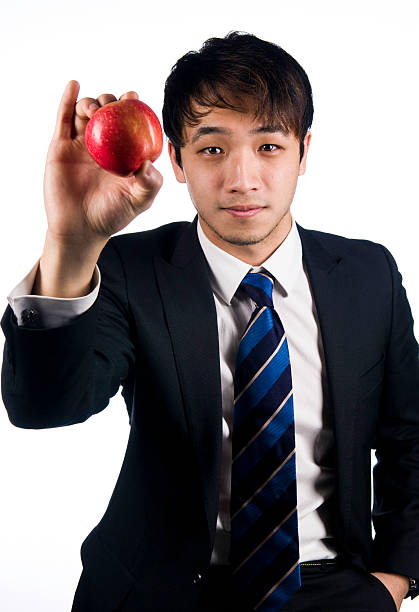 istock Asian businessman with red apple 178481759