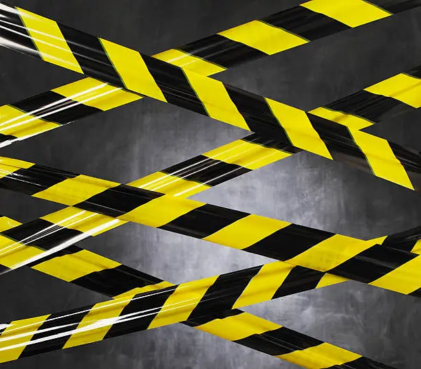Black and yellow plastic barrier tape blocking the way.