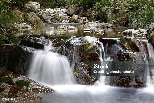Tranquil Waterfall Scene Stock Photo - Download Image Now - Beauty In Nature, Blurred Motion, Boulder - Rock