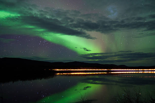 istock Stars and Northern Lights over dark Road at Lake 178482017