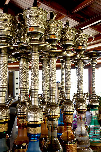Rows of colorful and decorated waterpipes stock photo