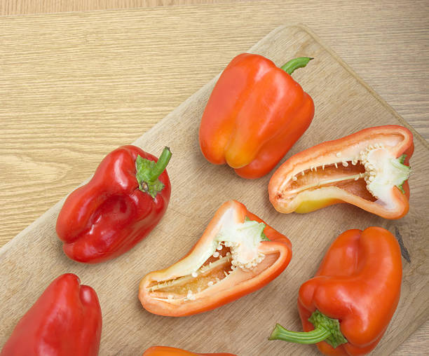 istock Ripe sweet peppers on brown kitchen desk closeup 178482145