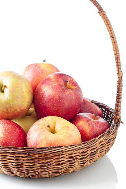istock Wicker basket full of apples 178482680
