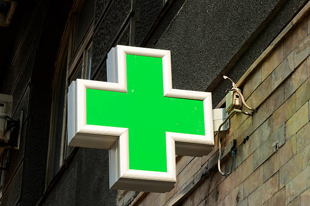 istock Close up green pharmacy cross sign 178483283