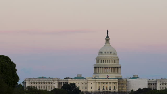 US Capitol Building in Washington DC, Seen from National Mall at Sunset