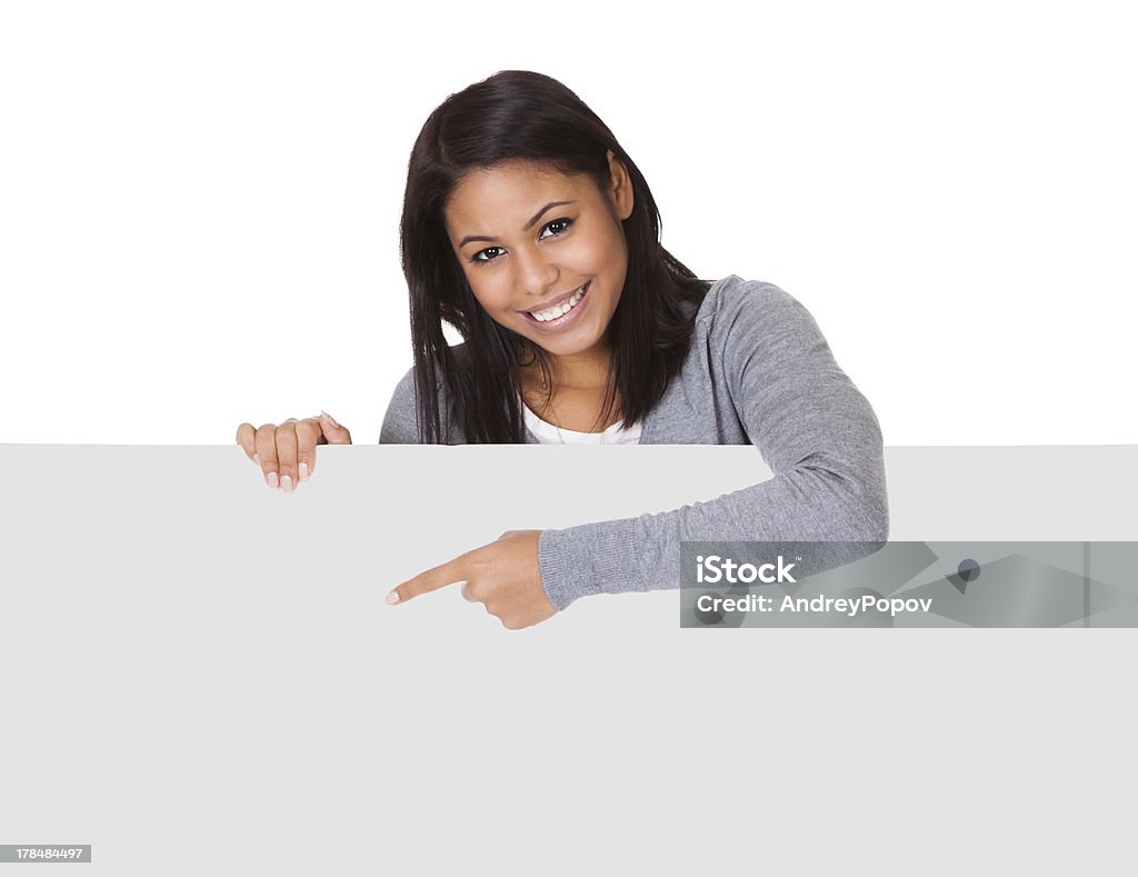 Young Woman Holding Placard Young Woman Holding Placard. Isolated On White Adult Stock Photo