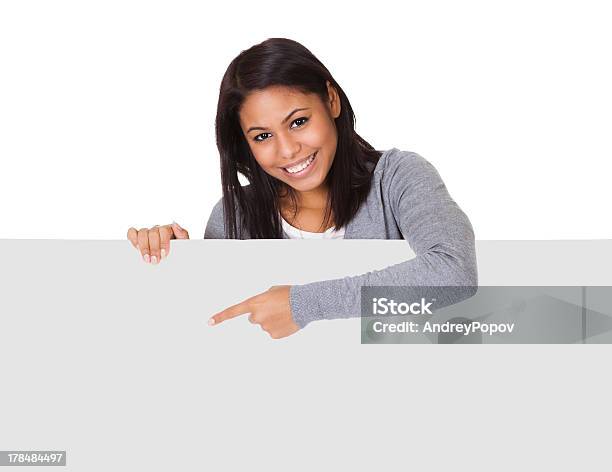 Young Woman Holding Placard Stock Photo - Download Image Now - Adult, Adults Only, Advertisement