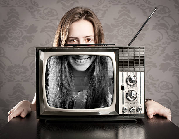 istock woman with old retro tv 178484614